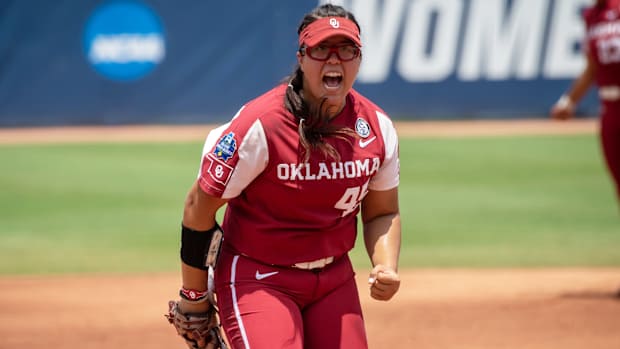 Jun 10, 2021; Oklahoma City, Oklahoma, USA; Oklahoma Sooners pitcher Giselle Juarez (45) reacts after a strike out against the Florida State Seminoles during the first inning during Game 3 of the NCAA Women's College World Series Championship Series at USA Softball Hall of Fame Stadium.